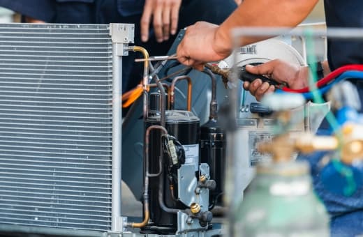 HVAC technician performing maintenance